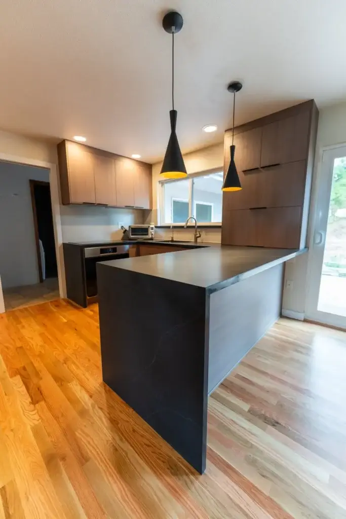 Black quartz waterfall peninsula in the Kent kitchen