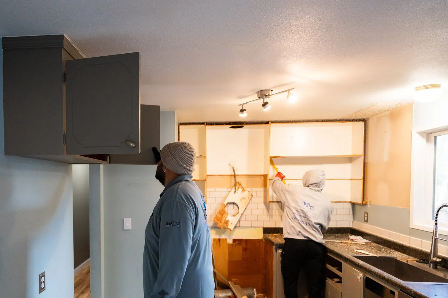 Our crew opening up the original Kirkland kitchen