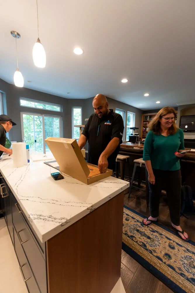 Final walkthrough with the homeowner in her finished kitchen