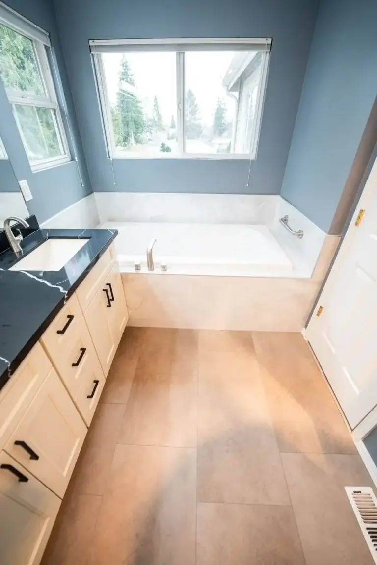 Tub alcove and vanity, slate-blue walls – Bathroom remodel in Renton, WA by NW Expert Builders