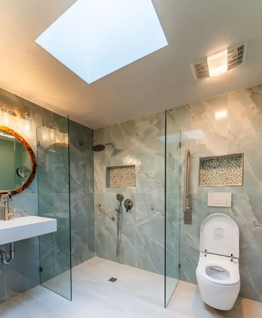 Curbless shower, floating sink and wall-hung toilet under a skylight – Accessible bathrooms remodel in West Seattle, WA by NW Expert Builders